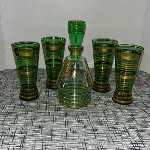 Green and gold decanter and four glasses vintage
